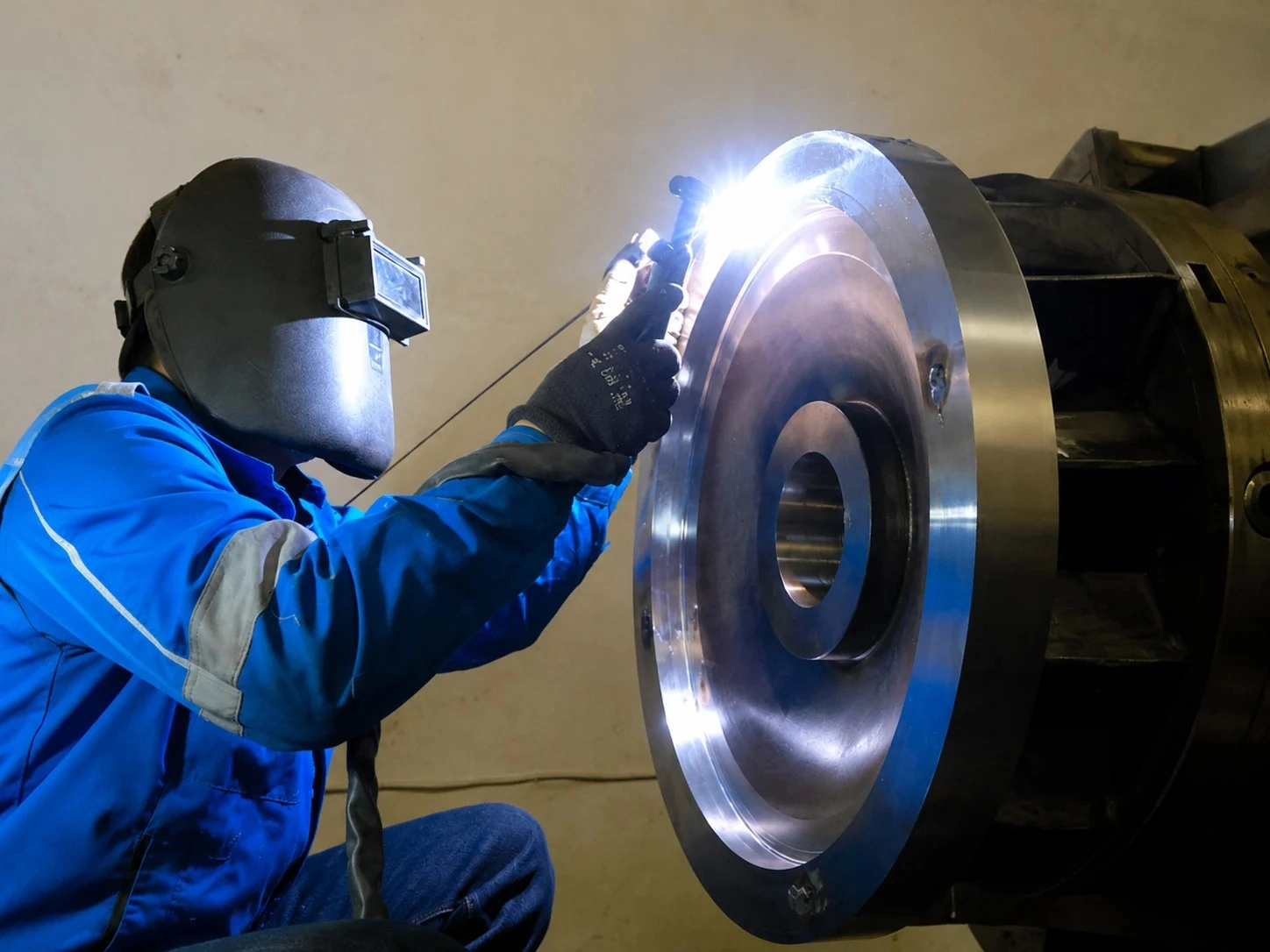 JPE welder performing precision work on a turbine flange